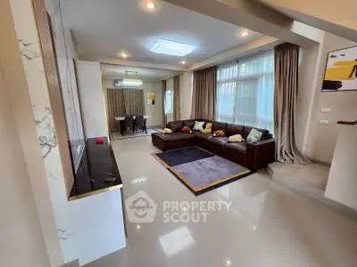 Spacious modern living room with elegant decor and large windows