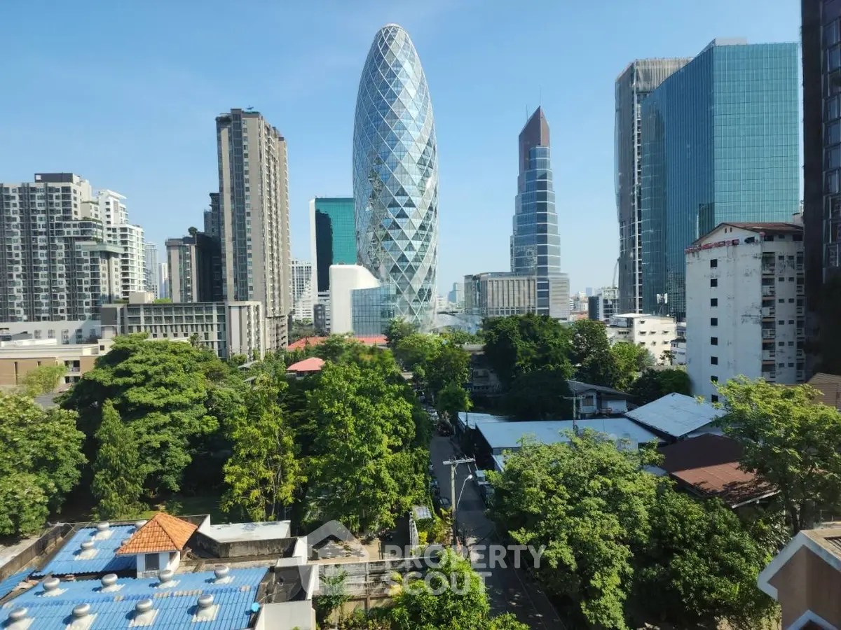 Stunning cityscape view with modern skyscrapers and lush greenery, perfect for urban living enthusiasts.