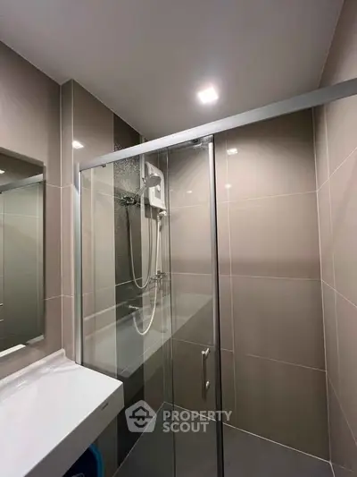 Modern bathroom with sleek shower enclosure and contemporary fixtures
