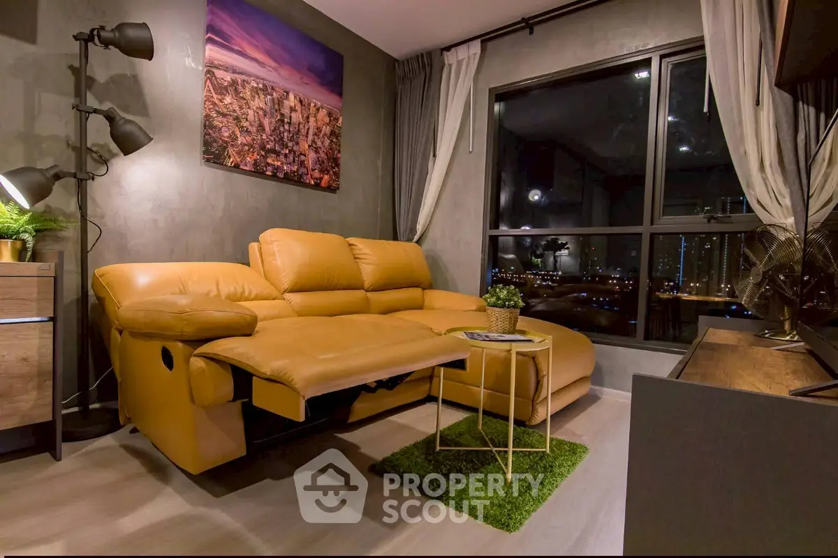 Stylish living room with leather sofa and city view, perfect for urban living.