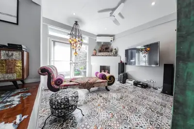 Chic living room with eclectic decor and patterned tile flooring