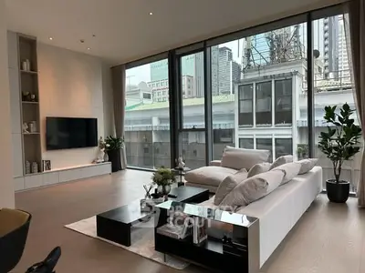 Luxurious modern living room with floor-to-ceiling windows and city view