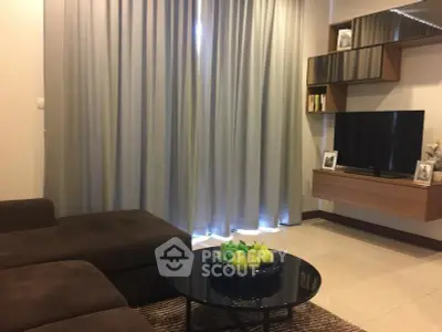 Modern living room with sleek furniture and stylish decor, perfect for relaxation and entertainment.