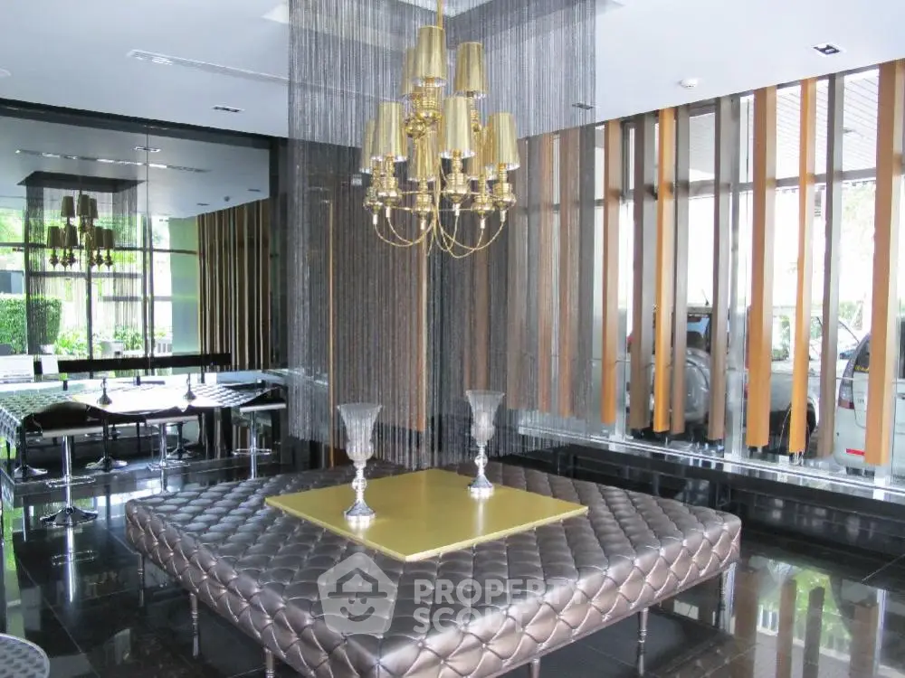 Luxurious modern living room with elegant chandelier and stylish decor