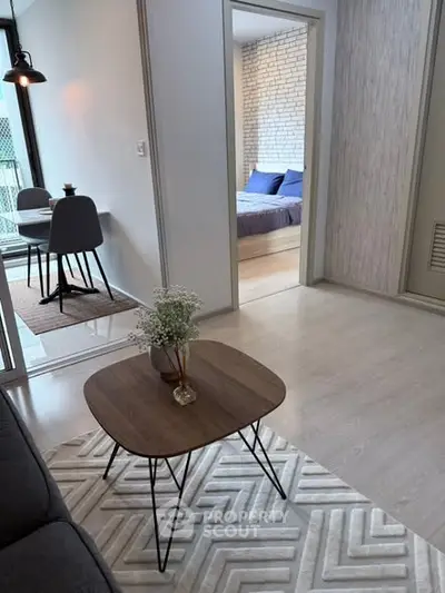 Modern apartment interior with stylish living room and cozy bedroom view.