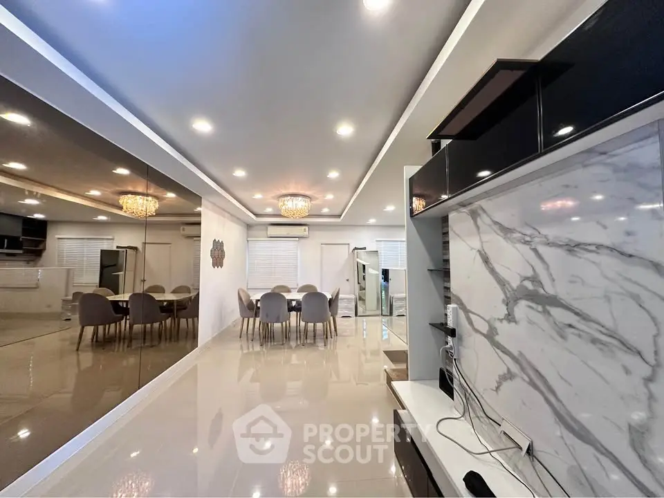 Luxurious modern living room with elegant dining area and marble accents