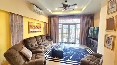 Spacious living room with plush seating and modern decor
