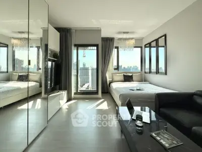 Modern living room with city view, featuring sleek furniture and large windows.