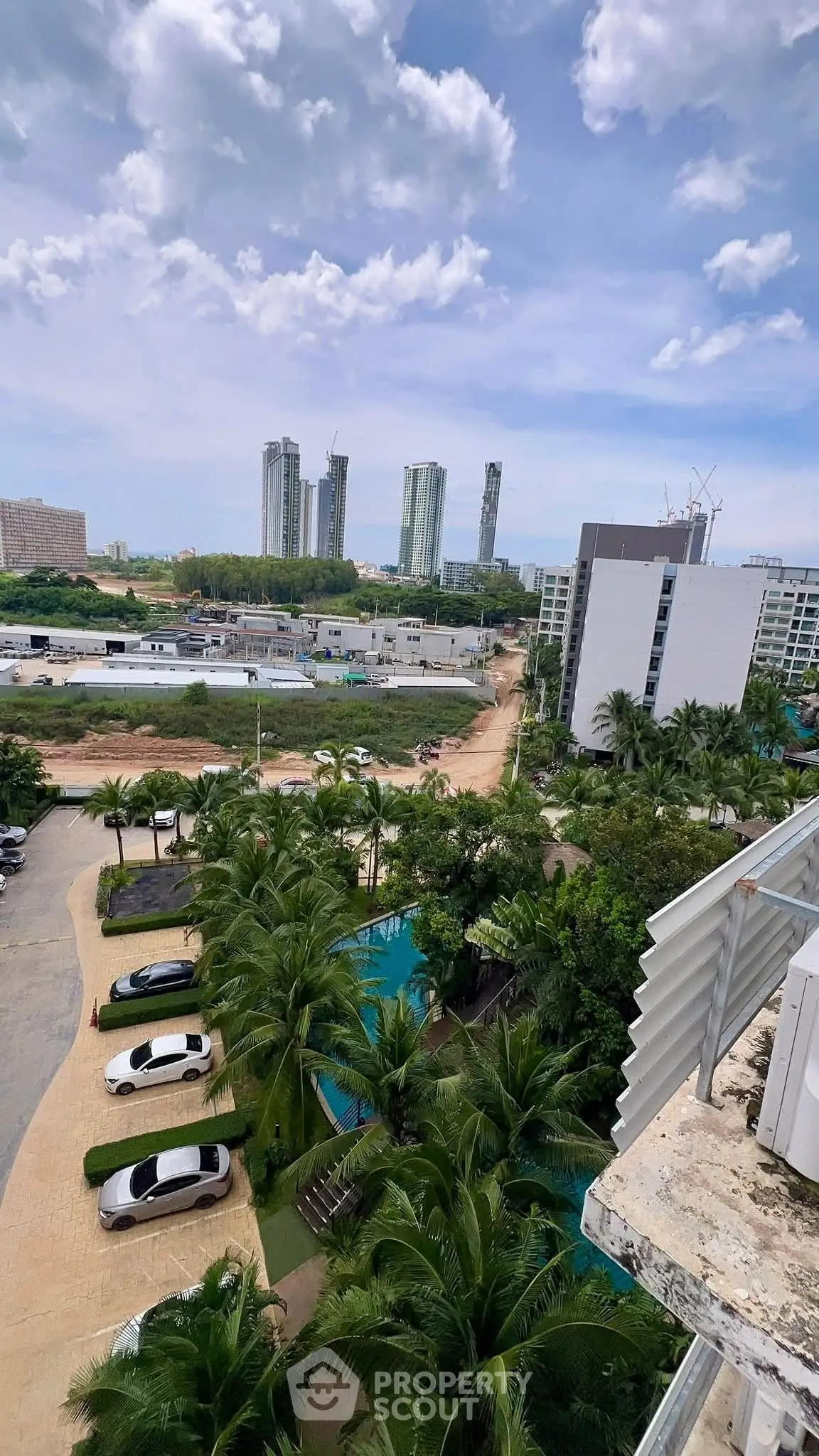Stunning high-rise cityscape view with lush greenery and modern buildings