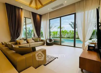 Luxurious living room with pool view and elegant decor
