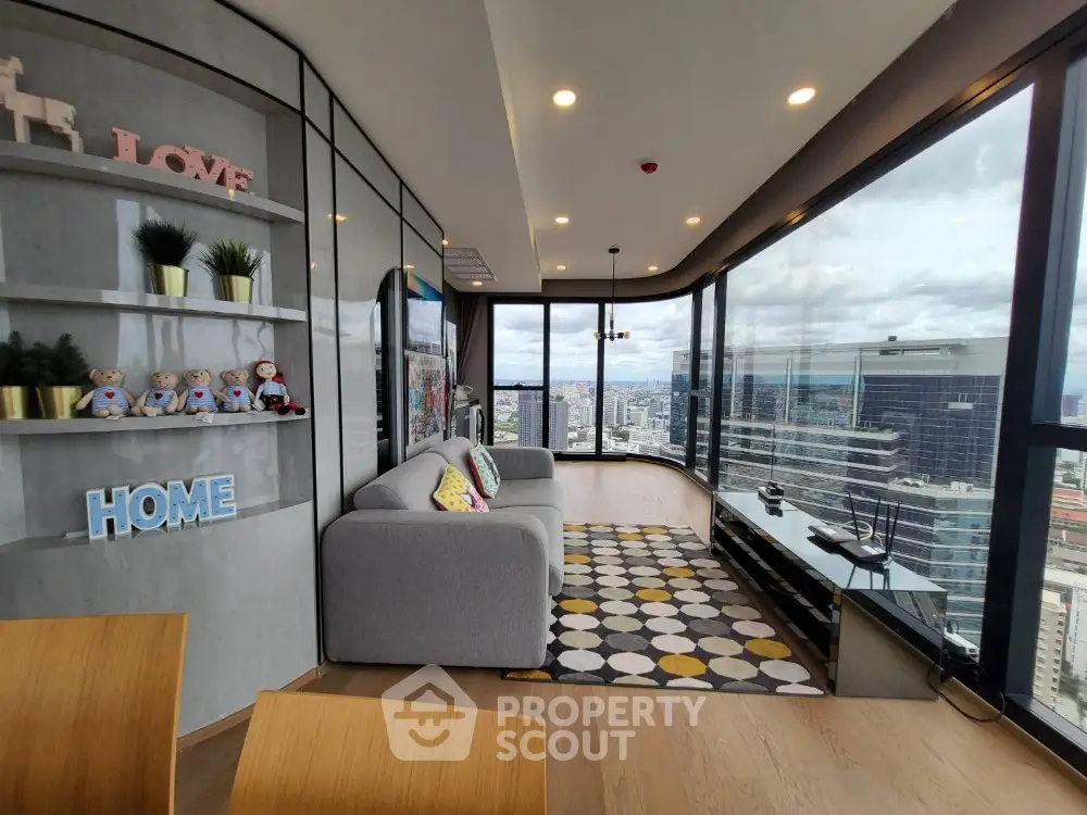 Stunning corner unit living room with panoramic city views and modern decor.