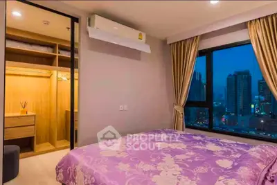 Luxurious bedroom with city view and walk-in closet in modern apartment
