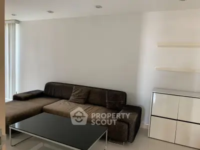 Modern living room with sleek furniture and minimalist design, perfect for contemporary urban living.