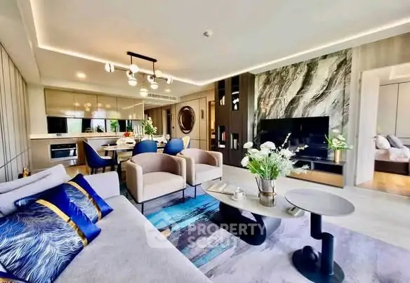 Luxurious modern living room with elegant decor and open layout, featuring stylish furniture and vibrant accents.