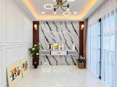 Elegant modern living room with marble accent wall and stylish lighting