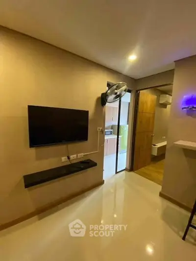 Modern living room with wall-mounted TV and sleek design