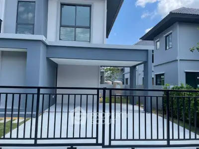 Modern two-story house with sleek design and spacious driveway