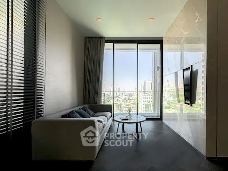 Modern living room with panoramic city view and sleek interior design.