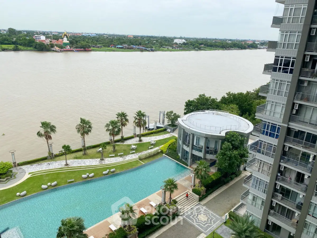Stunning riverfront view with pool and modern high-rise building