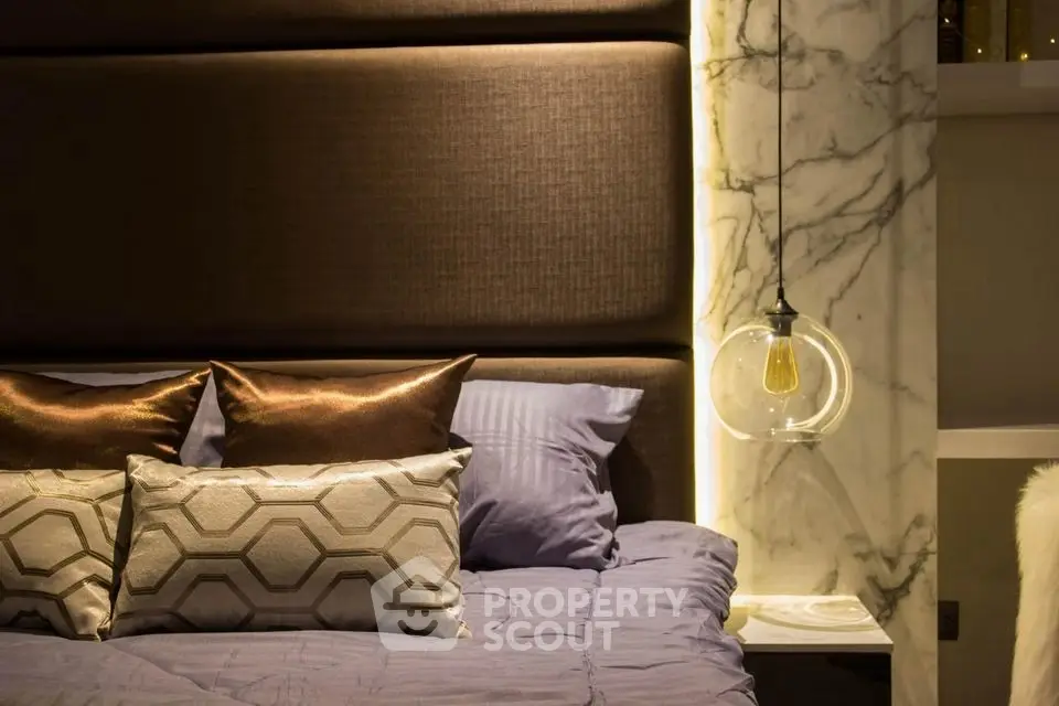 Luxurious bedroom with elegant lighting and plush pillows