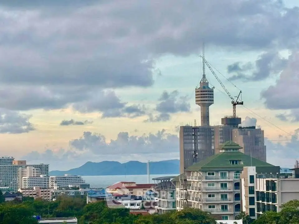 Stunning cityscape view with ocean backdrop and modern architecture.