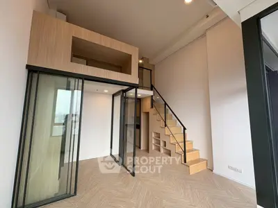 Modern loft apartment with mezzanine and glass partitions