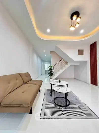 Spacious modern living room with elegant lighting and stylish furniture