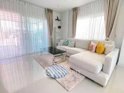 Bright and airy living room with modern sectional sofa and elegant decor.