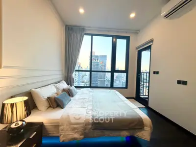 Luxurious bedroom with city view and modern decor in high-rise apartment