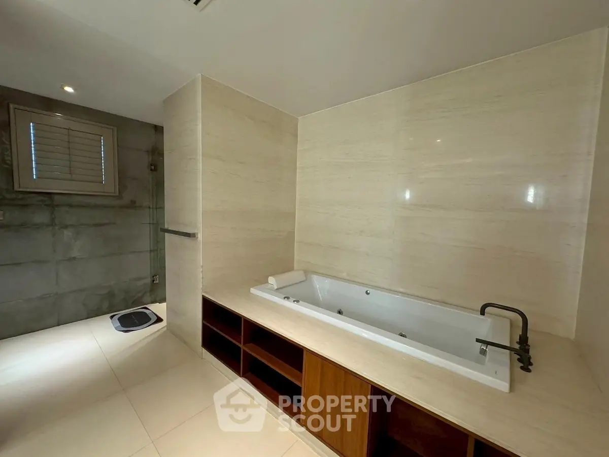 Luxurious bathroom with elegant bathtub and modern design, perfect for relaxation and comfort.