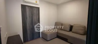 Cozy small living room with modern sofa and air conditioning