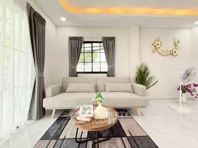 Elegant living room with modern decor and natural light