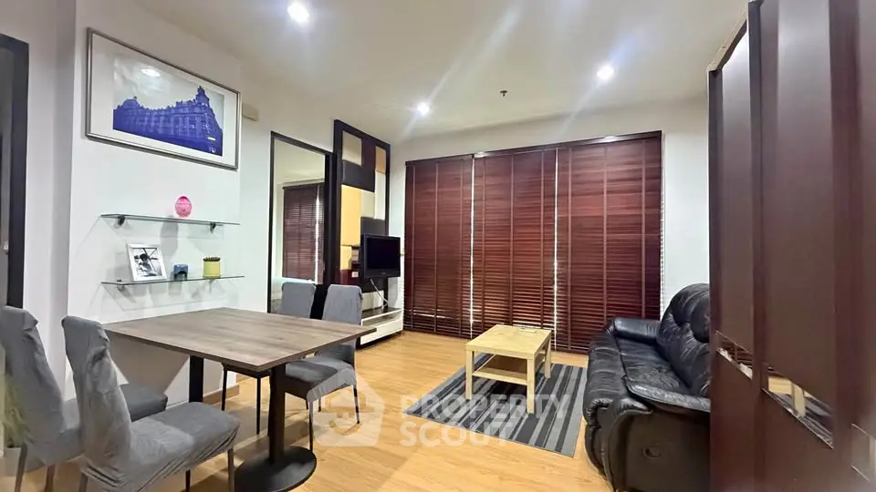 Modern living room with stylish furniture and wooden flooring