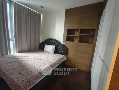 Cozy bedroom with stylish headboard and ample natural light