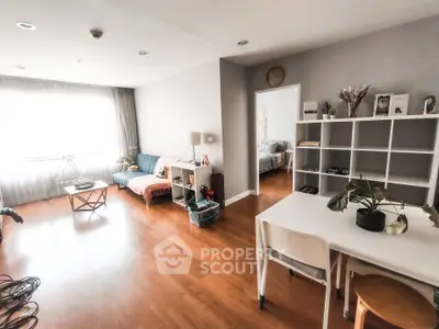 Spacious modern living room with wooden flooring and stylish decor