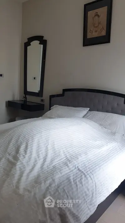 Cozy bedroom with elegant decor and plush bedding, perfect for relaxation and comfort.