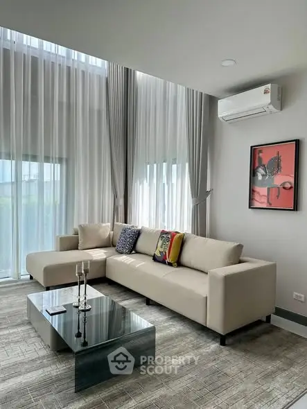 Spacious modern living room with high ceilings and elegant decor