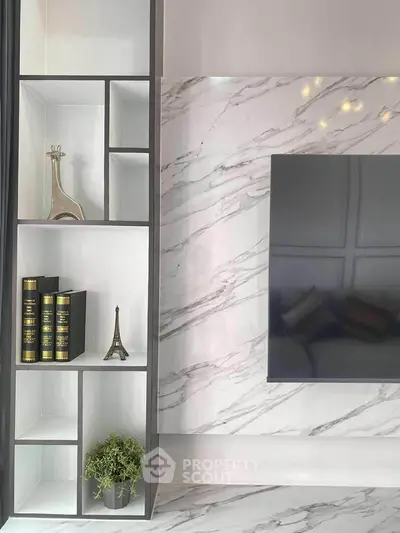 Modern living room with elegant marble wall and stylish shelving