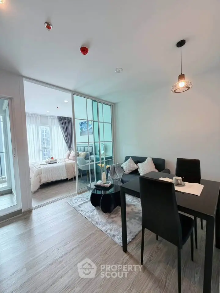 Modern open-plan living and dining area with stylish decor and natural light