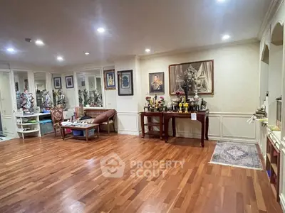 Spacious living room with wooden flooring and elegant decor