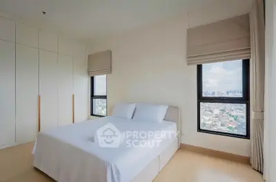 Spacious bedroom with city view and ample natural light