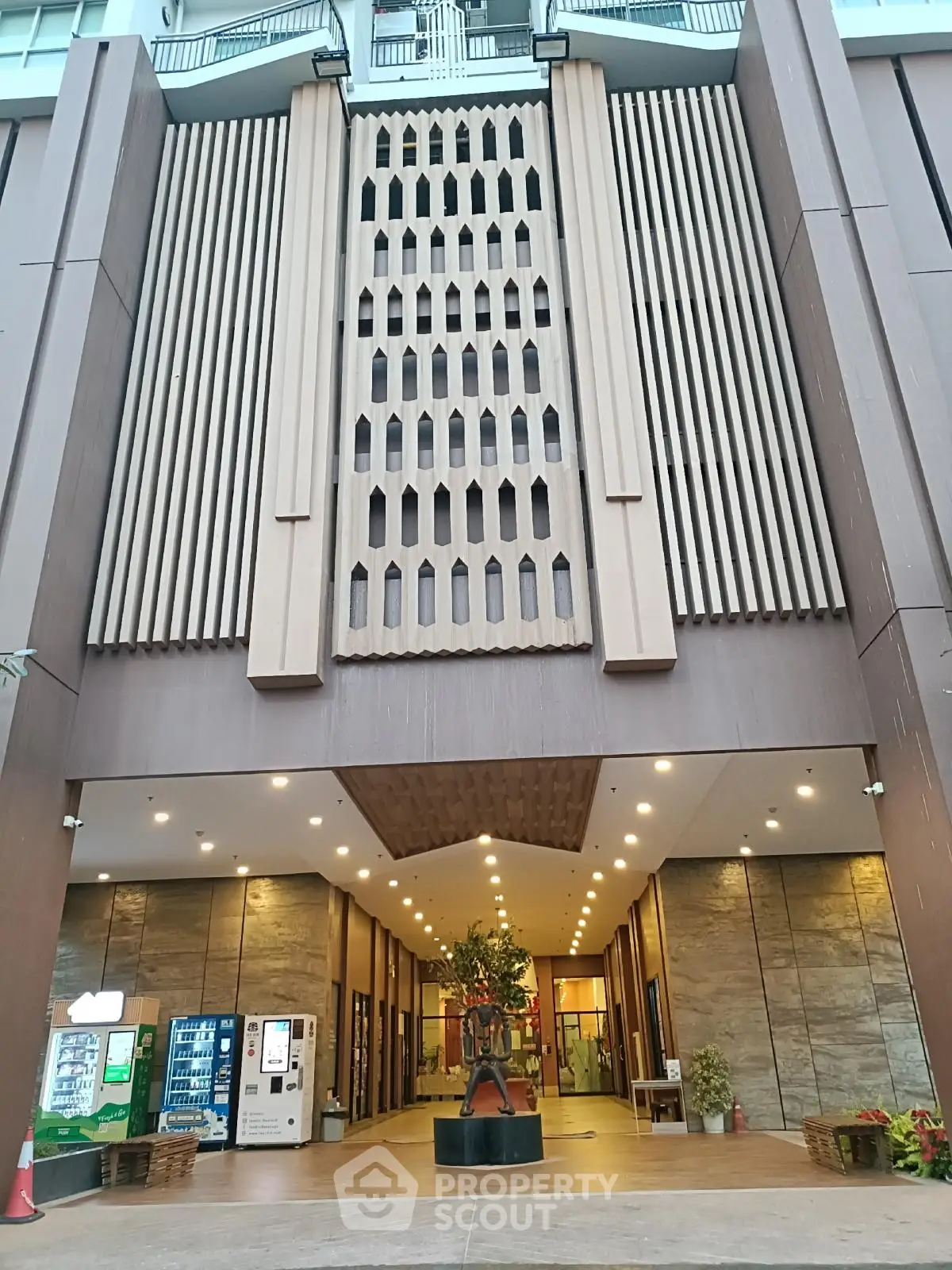Elegant building entrance with modern architectural design and ambient lighting