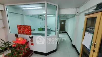 Modern office space with glass partitions and vibrant decor