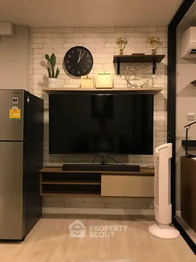 Modern living room with wall-mounted TV, sleek shelves, and stylish decor.