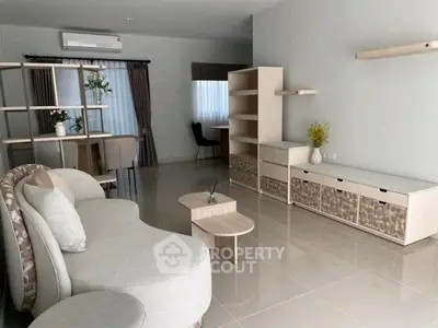 Spacious modern living room with elegant furniture and natural light