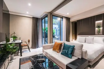 Luxurious modern bedroom with stylish decor and private balcony access