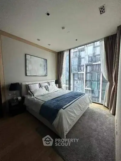 Luxurious bedroom with floor-to-ceiling windows and modern decor