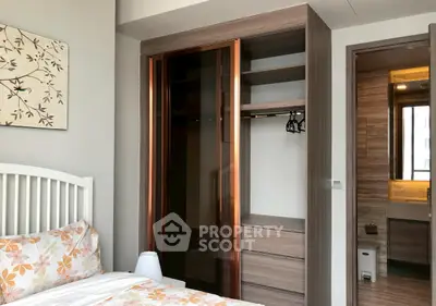 Modern bedroom with built-in wardrobe and ensuite bathroom
