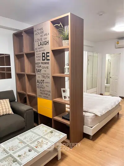 Modern studio apartment with stylish partition and cozy decor