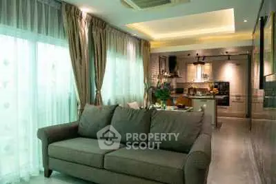 Modern living room with open kitchen and elegant decor